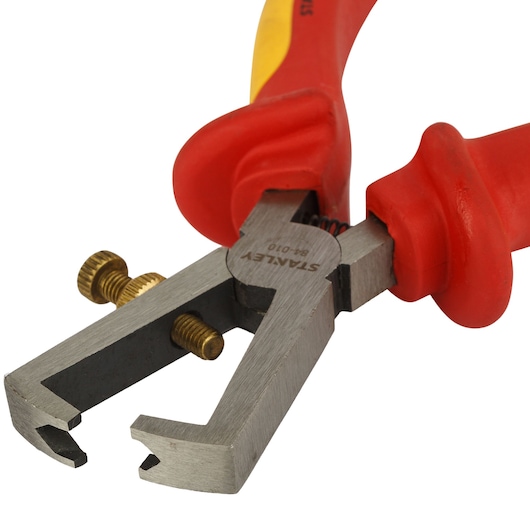 Photo of STANLEY 0-84-010 wire stripper with red and yellow handle, shown on white background, angled close-up.