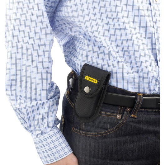 STANLEY 0-84-519 tool pouch attached to a belt, black fabric case with button closure, worn on jeans.