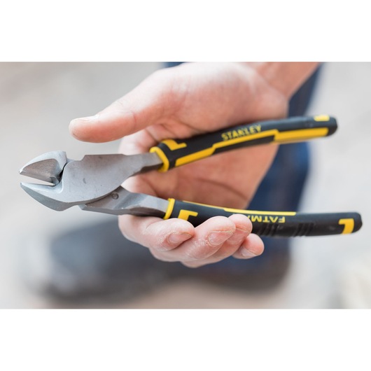 STANLEY 0-89-861 diagonal cutting pliers with black and yellow handles held in hand.