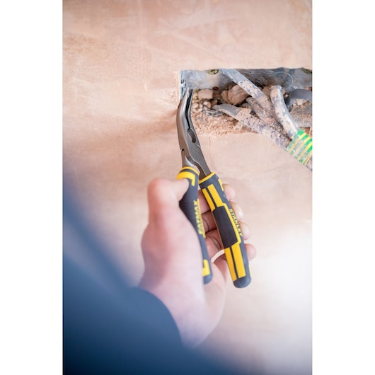 STANLEY 0-89-871 long nose pliers with yellow and black handles used for electrical wiring.