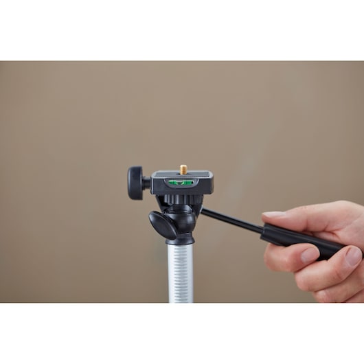 STANLEY 1-77-201 photography tripod head, close-up view, hand adjusting handle.