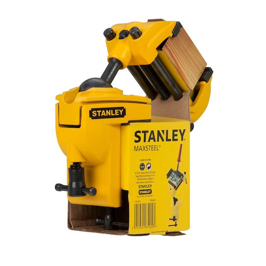 STANLEY 1-83-069 yellow bench vise with multi-angle head, shown in packaging, front right angle.