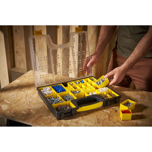 STANLEY 1-92-748 organizer with yellow compartments, open lid, assorted hardware, angled view.