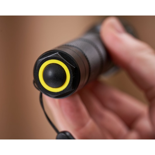 STANLEY 1-95-152 flashlight close-up showing textured grip and yellow-ringed power button.