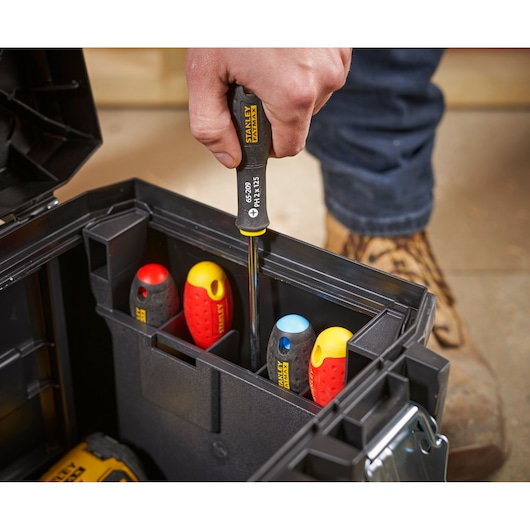 STANLEY 1-95-615 photography of hand using screwdriver set in black tool box.