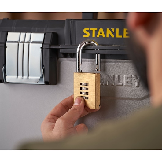 STANLEY 1-95-622 photography of gold combination padlock on toolbox, close-up front angle.
