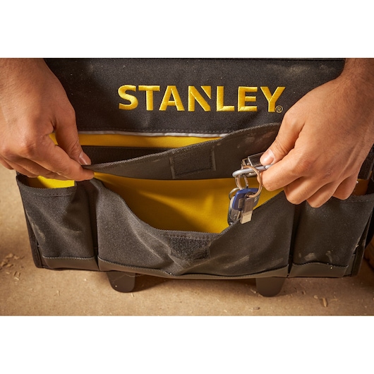 STANLEY 1-97-515 tool bag front pocket with key clip, close-up photo.