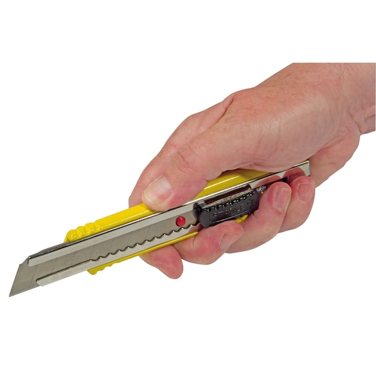 STANLEY 8-10-421 yellow utility knife held in hand, side view showing segmented blade and black slider.