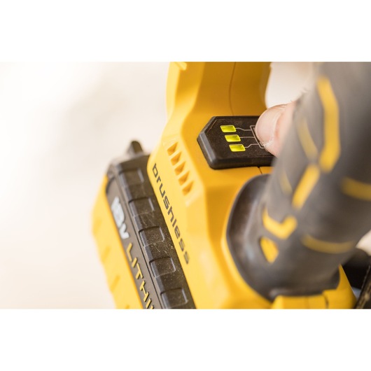 STANLEY FMCD900B cordless brushless tool close-up showing battery indicator lights and power button.