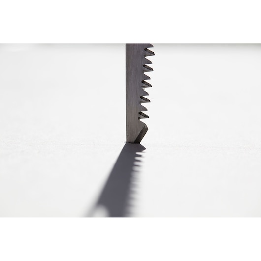 STANLEY FMHT0-20559 saw blade close-up, vertical angle, sharp teeth casting shadow on white background