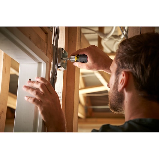 Photography of STANLEY FMHT0-62688 screwdriver used on an electrical box during installation.