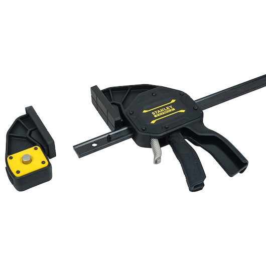 STANLEY FMHT0-83242 quick grip bar clamp with black body, yellow logo, and removable jaw, side angle.