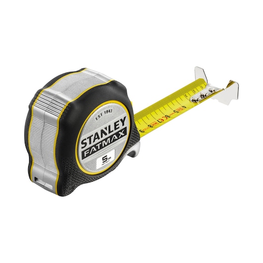 Photo of STANLEY FATMAX tape measure, SKU FMHT38214-0, black and silver casing, extended yellow blade, angled view.