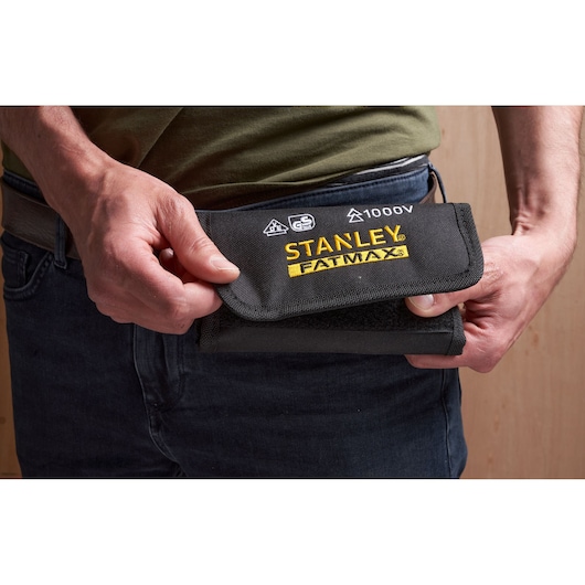 Photo of STANLEY FMHT66426-0 FATMAX tool pouch in black, held at waist, product category: photography