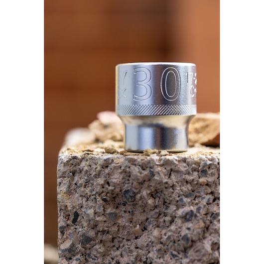 STANLEY FMMT82681-0 socket, 30mm, silver finish, close-up angle on rough stone surface.