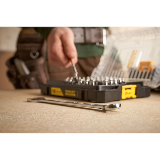 STANLEY FMMT98104-0 wrench and socket set with hard case, close-up on workbench.