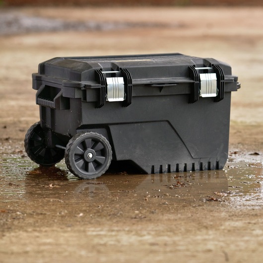 STANLEY FMST1-73601 black rolling toolbox with metal latches, photography, outdoor angle.