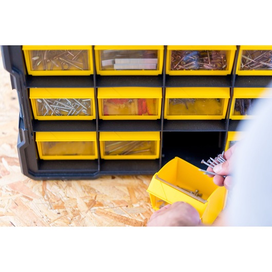 STANLEY FMST81077-1 organizer with yellow drawers, filled with screws and hardware, front angle.