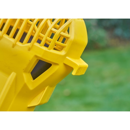 STANLEY SFMCBL714B-XJ yellow plastic blower housing close-up, outdoor angle.