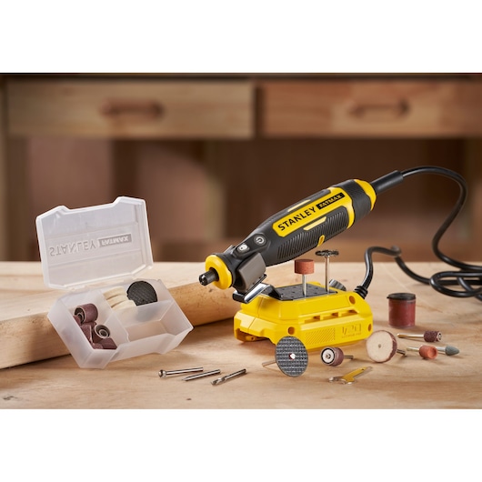 STANLEY SFMCE030B rotary tool set with attachments and accessories on workbench, front angle.