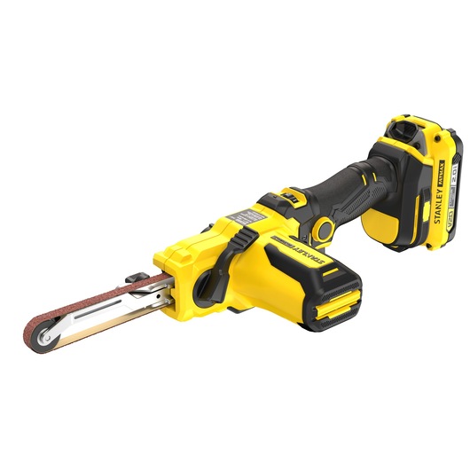 Photo of STANLEY SFMCE210D2 cordless belt file sander, yellow and black, side angle on white background.