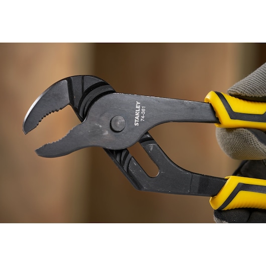 Stanley STHT0-74361 adjustable groove joint pliers with yellow and black handle, close-up view.