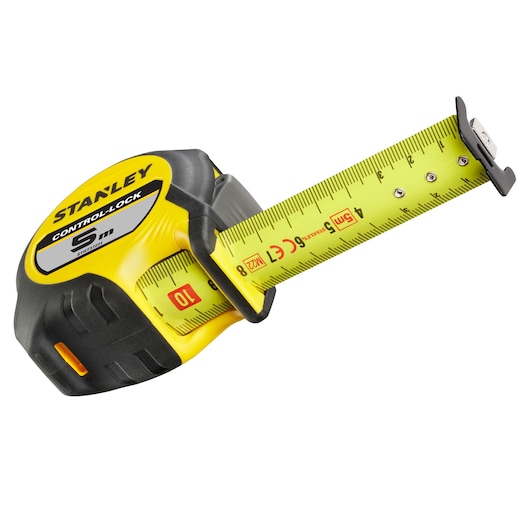 Photo of STANLEY STHT37231-0 yellow and black 5m tape measure angled on white background.